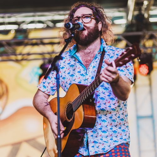 Gerry Paul playing guitar and singing