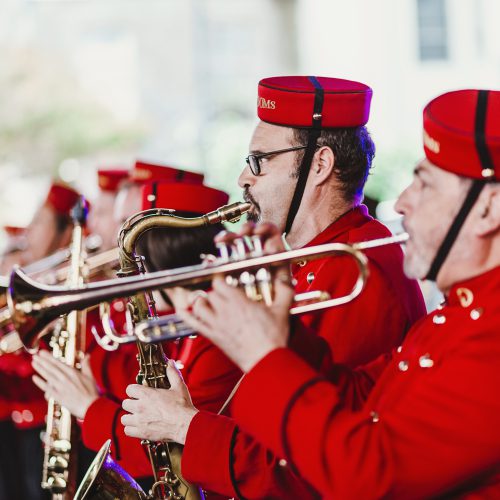 Brass band performing at CubaDupa in red costume