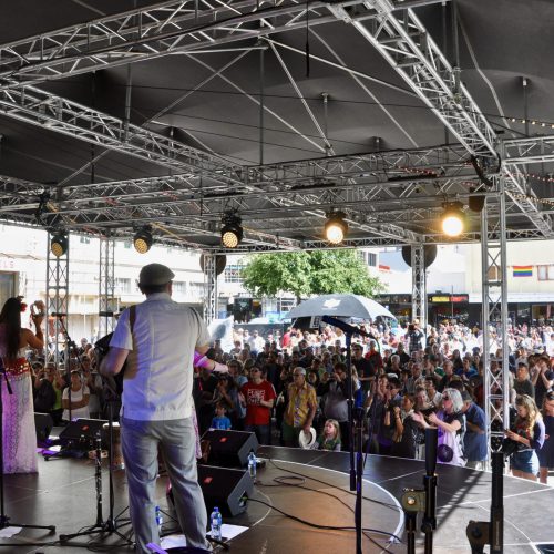 Samba Band playing on the Swan Stage looking out over a big crowd in the carpark